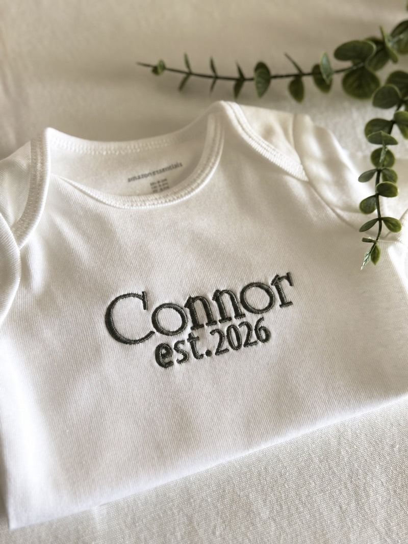 Sample: Connor est. 2026 embroidered in the University font, thread 0238