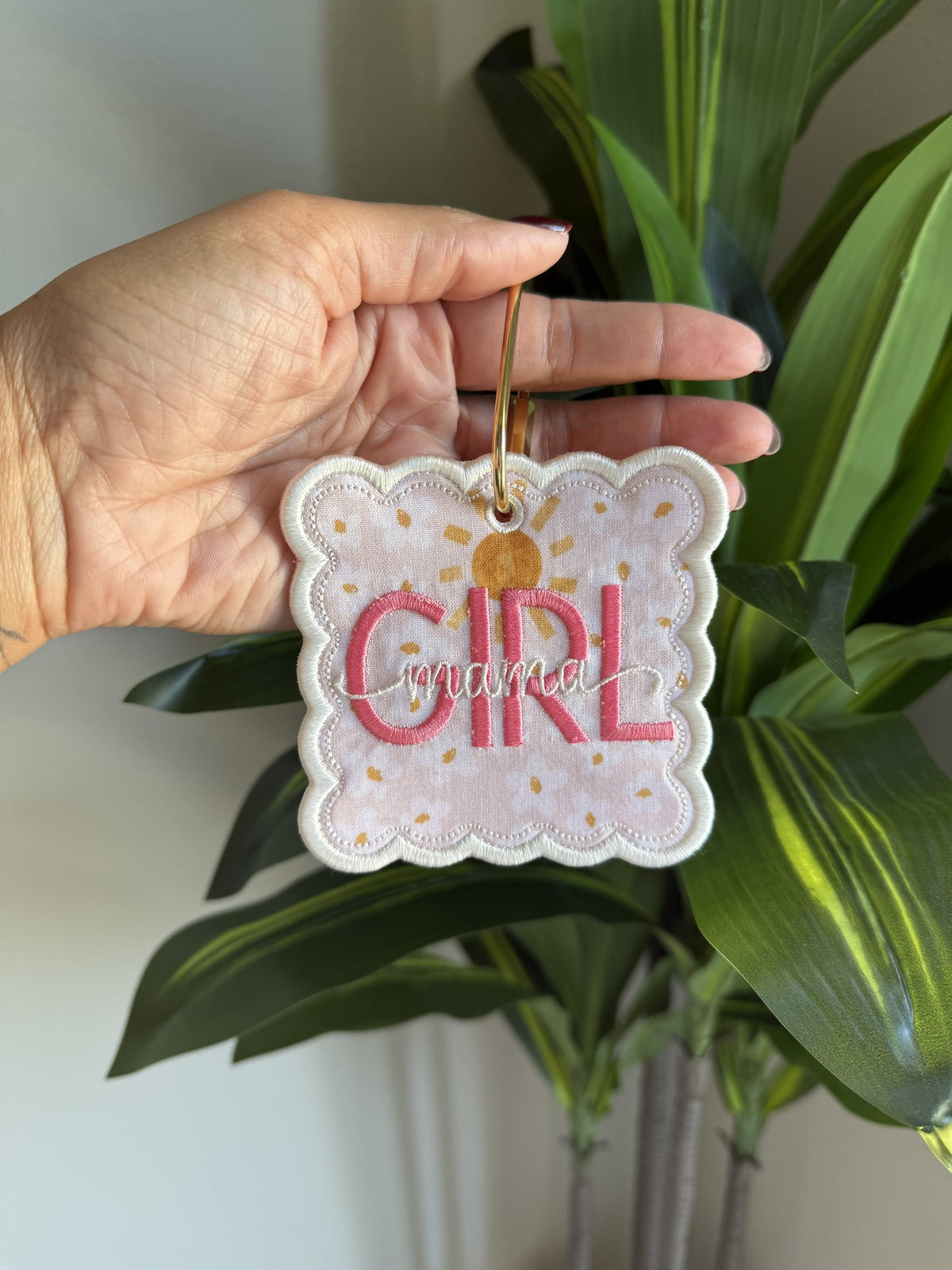 Girl Mom Bag Tag: GIRL with mama in script on a sunshine print, white scalloped border